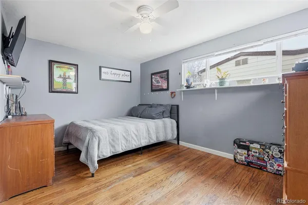 a bedroom with a bed and a tv