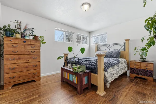 a bedroom with a bed and a dresser