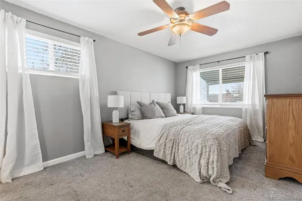 a bed room with a bed and a window