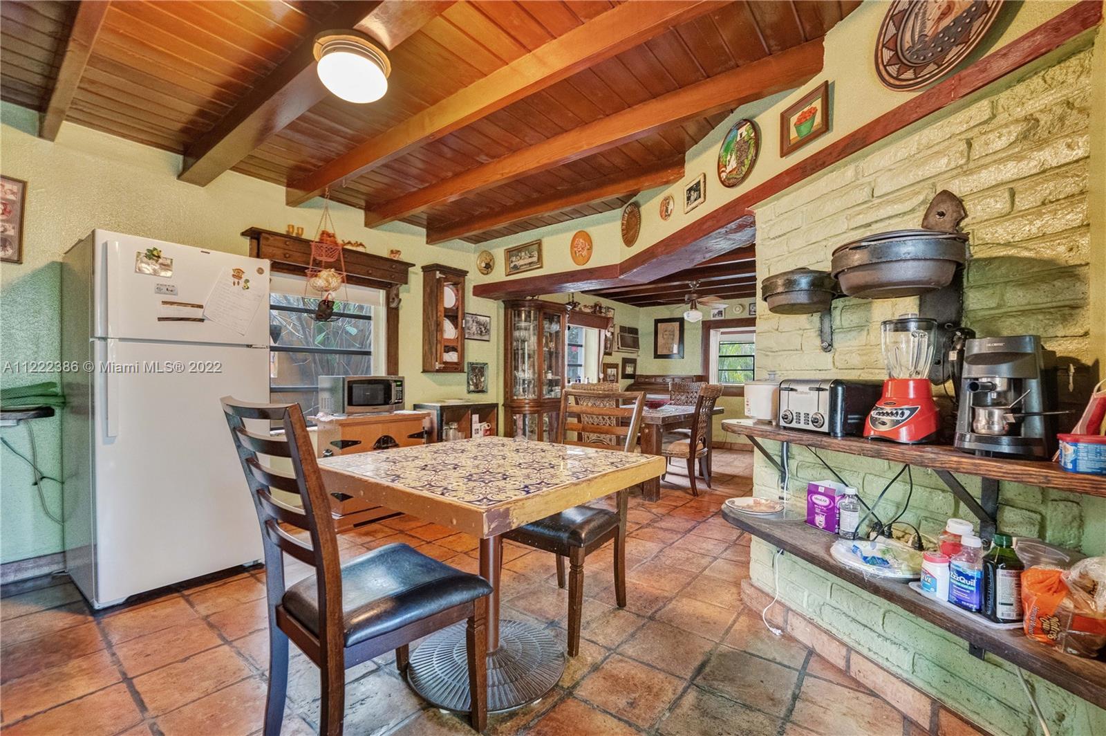 830 East 18th Street Hialeah, FL 33013 - Photo 14 of 37 a outdoor dining space with lots of furniture and racks