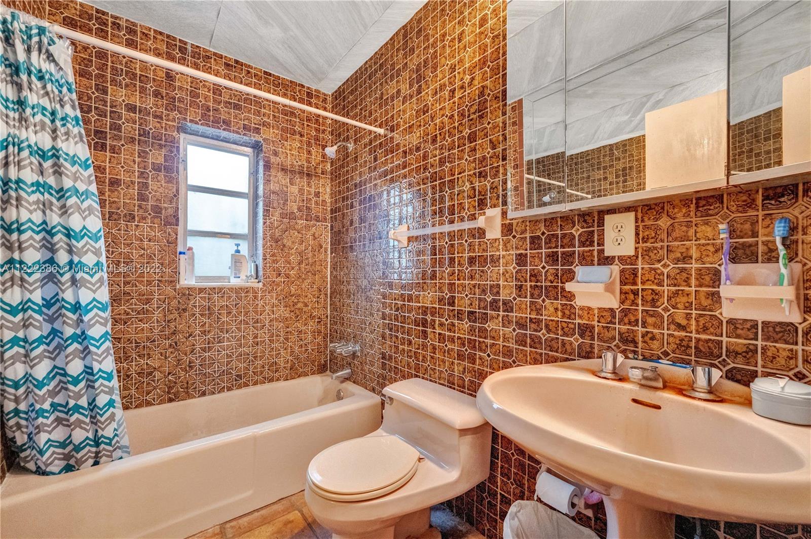 830 East 18th Street Hialeah, FL 33013 - Photo 18 of 37 a bathroom with a sink a toilet and shower