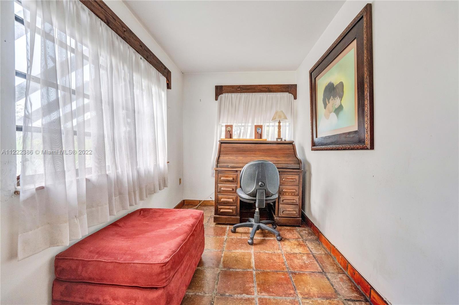 830 East 18th Street Hialeah, FL 33013 - Photo 20 of 37 a room with chair and wooden floor