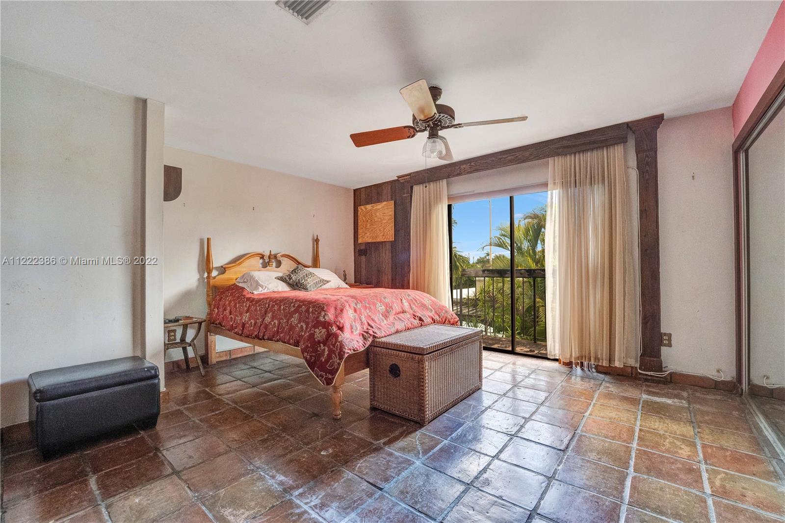 830 East 18th Street Hialeah, FL 33013 - Photo 21 of 37 a spacious bedroom with a bed and a window