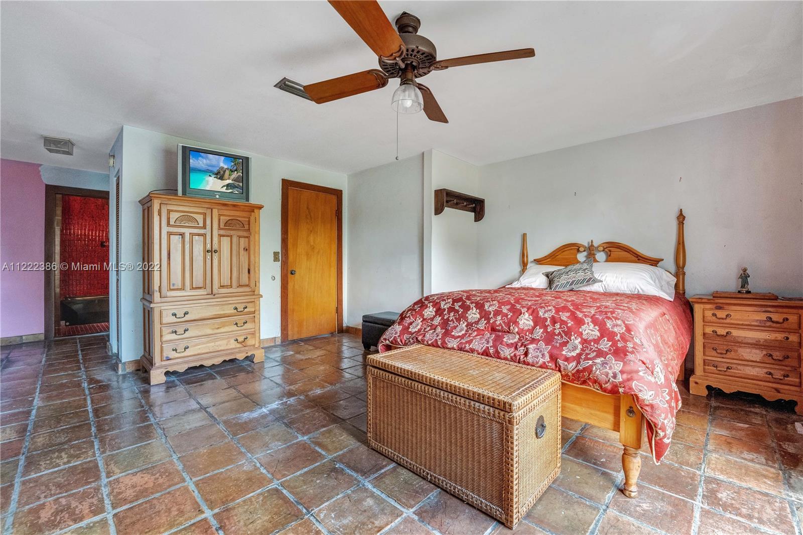 830 East 18th Street Hialeah, FL 33013 - Photo 22 of 37 a bedroom with a bed and a view of walk in closet