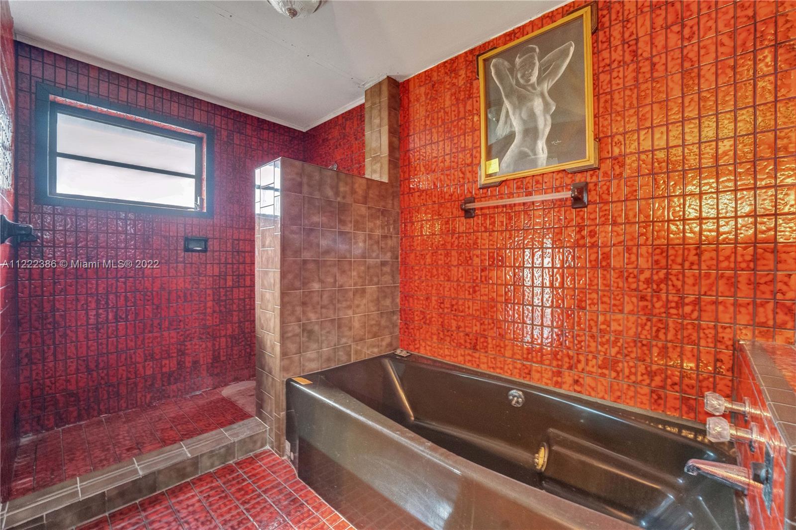 830 East 18th Street Hialeah, FL 33013 - Photo 23 of 37 a bathroom with a tub and shower