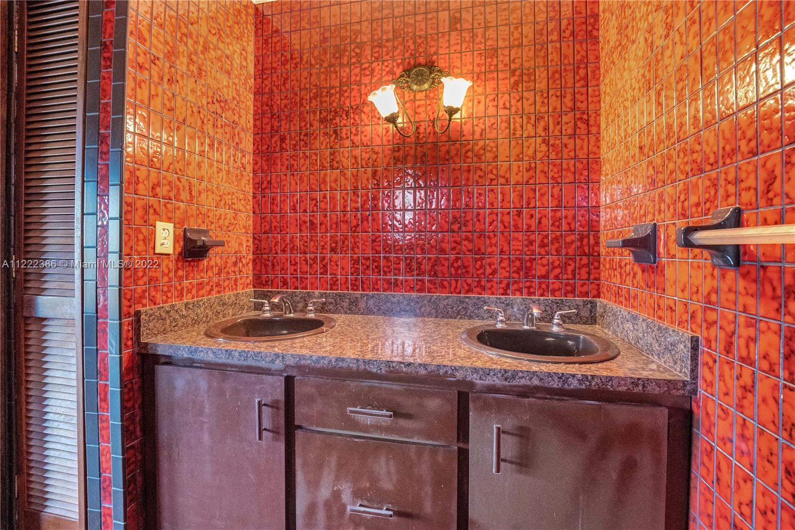 830 East 18th Street Hialeah, FL 33013 - Photo 24 of 37 a bathroom with a sink and a sink
