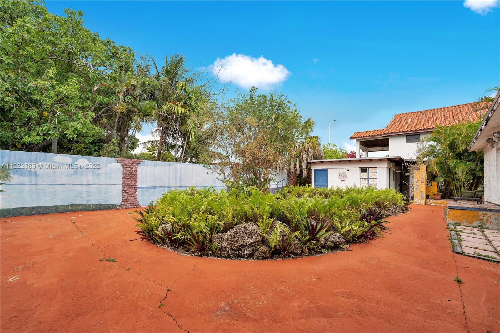 830 East 18th Street Hialeah, FL 33013 - Photo 32 of 37 a view of a garden with a fountain