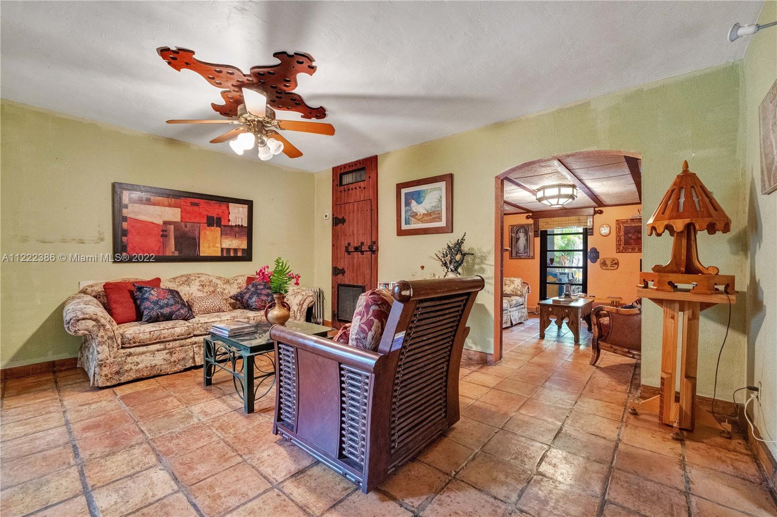 830 East 18th Street Hialeah, FL 33013 - Photo 6 of 37 a living room with fireplace furniture and a flat screen tv