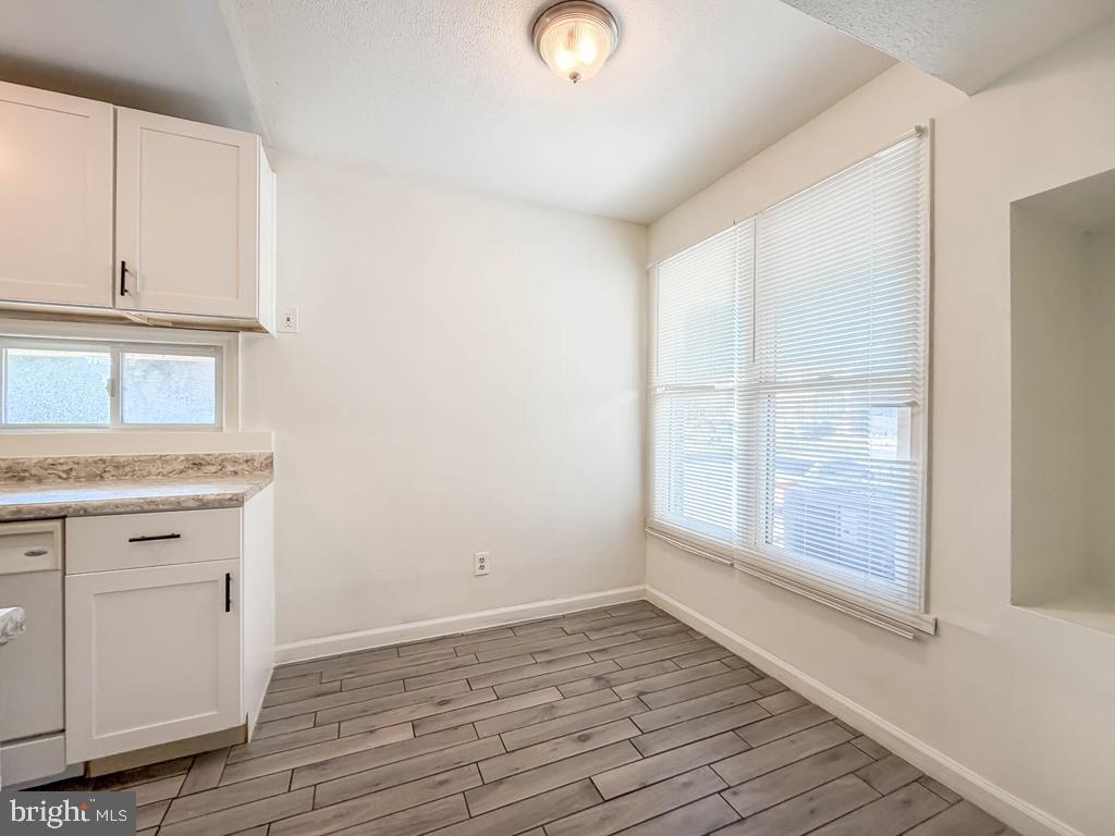 3850 Woodhaven Road, Unit 901 Philadelphia, PA 19154 - Photo 14 of 24 a view of an empty room with wooden floor and a window