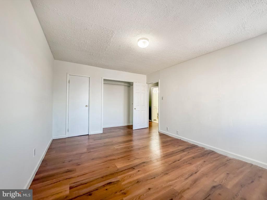 3850 Woodhaven Road, Unit 901 Philadelphia, PA 19154 - Photo 16 of 24 a view of an empty room and wooden floor