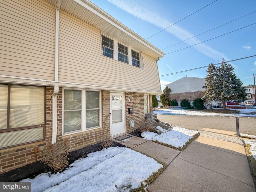 3850 Woodhaven Road, Unit 901 Philadelphia, PA 19154 - Photo 4 of 24 a front view of a house with a yard