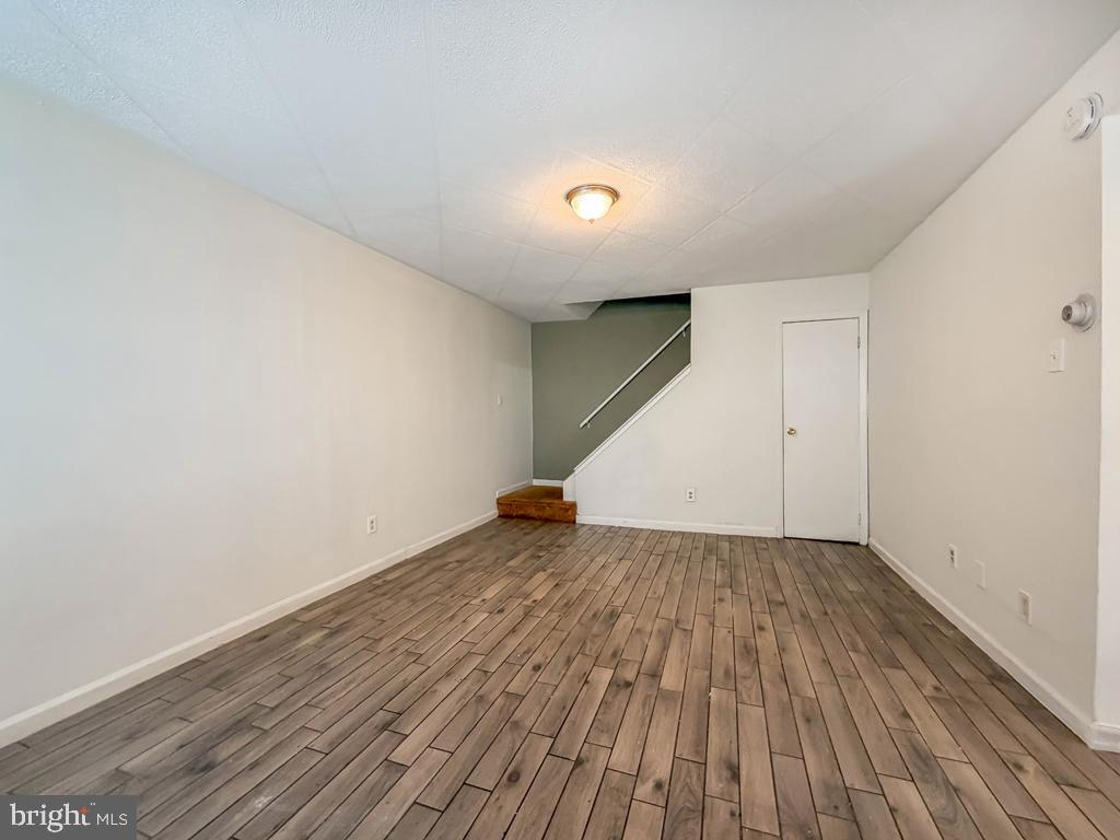 3850 Woodhaven Road, Unit 901 Philadelphia, PA 19154 - Photo 6 of 24 an empty room with wooden floor