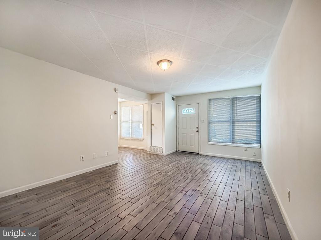 3850 Woodhaven Road, Unit 901 Philadelphia, PA 19154 - Photo 7 of 24 a view of an empty room with wooden floor and closet