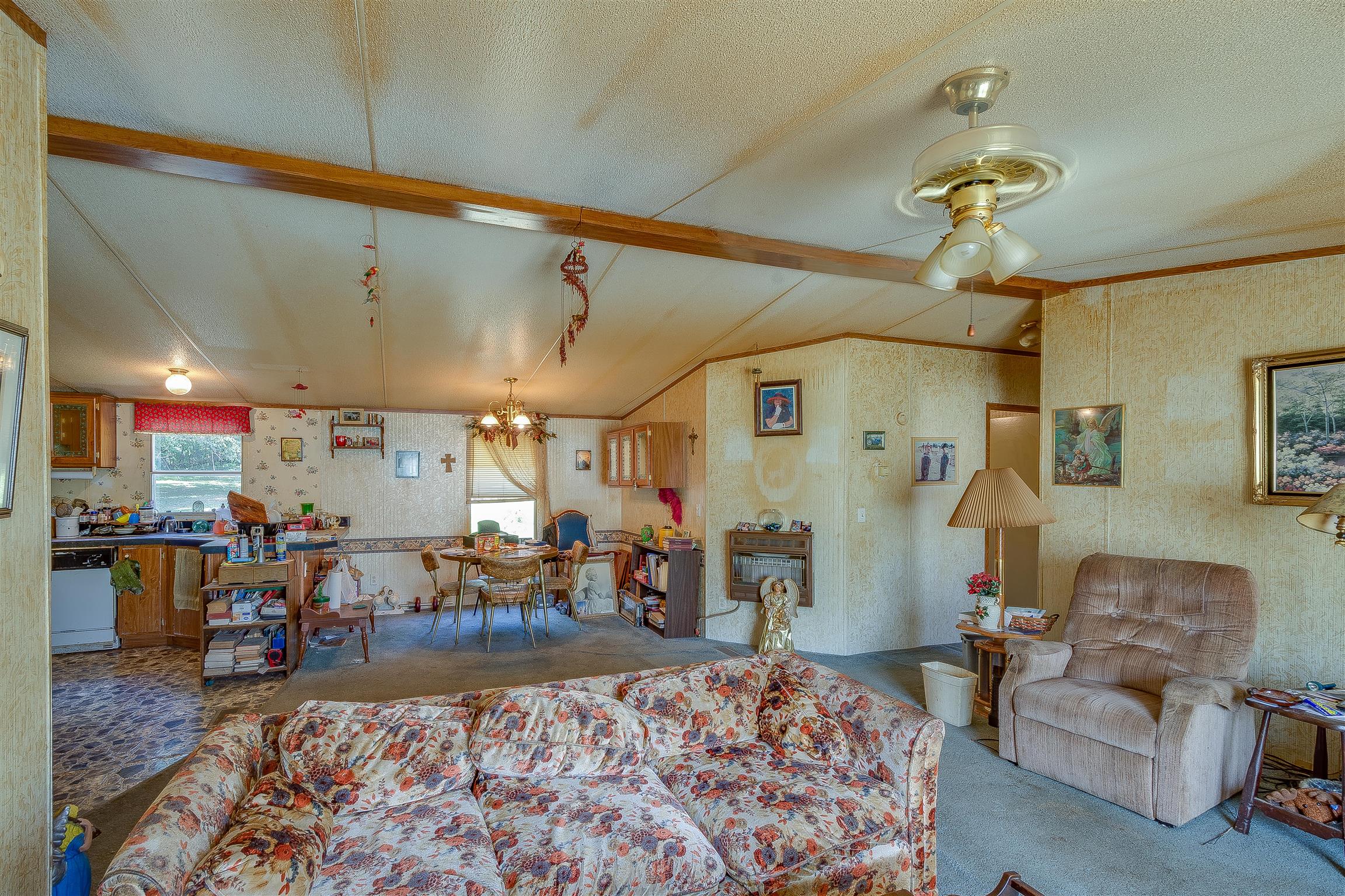 667 Petty Hollow Road Prospect, TN 38477 - Photo 18 of 28 a living room with lots of furniture and a chandelier
