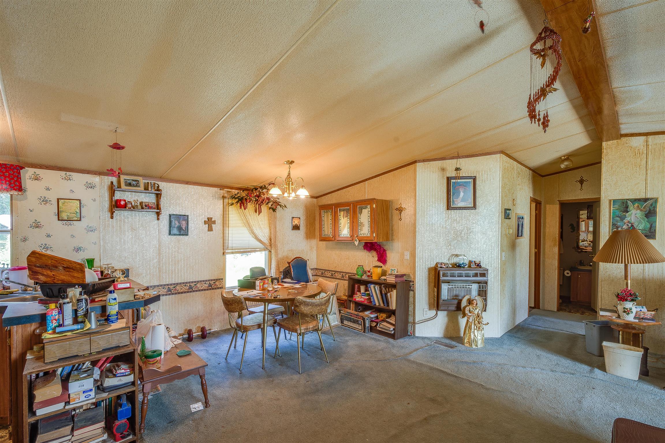 667 Petty Hollow Road Prospect, TN 38477 - Photo 20 of 28 a living room with lots of furniture and a chandelier