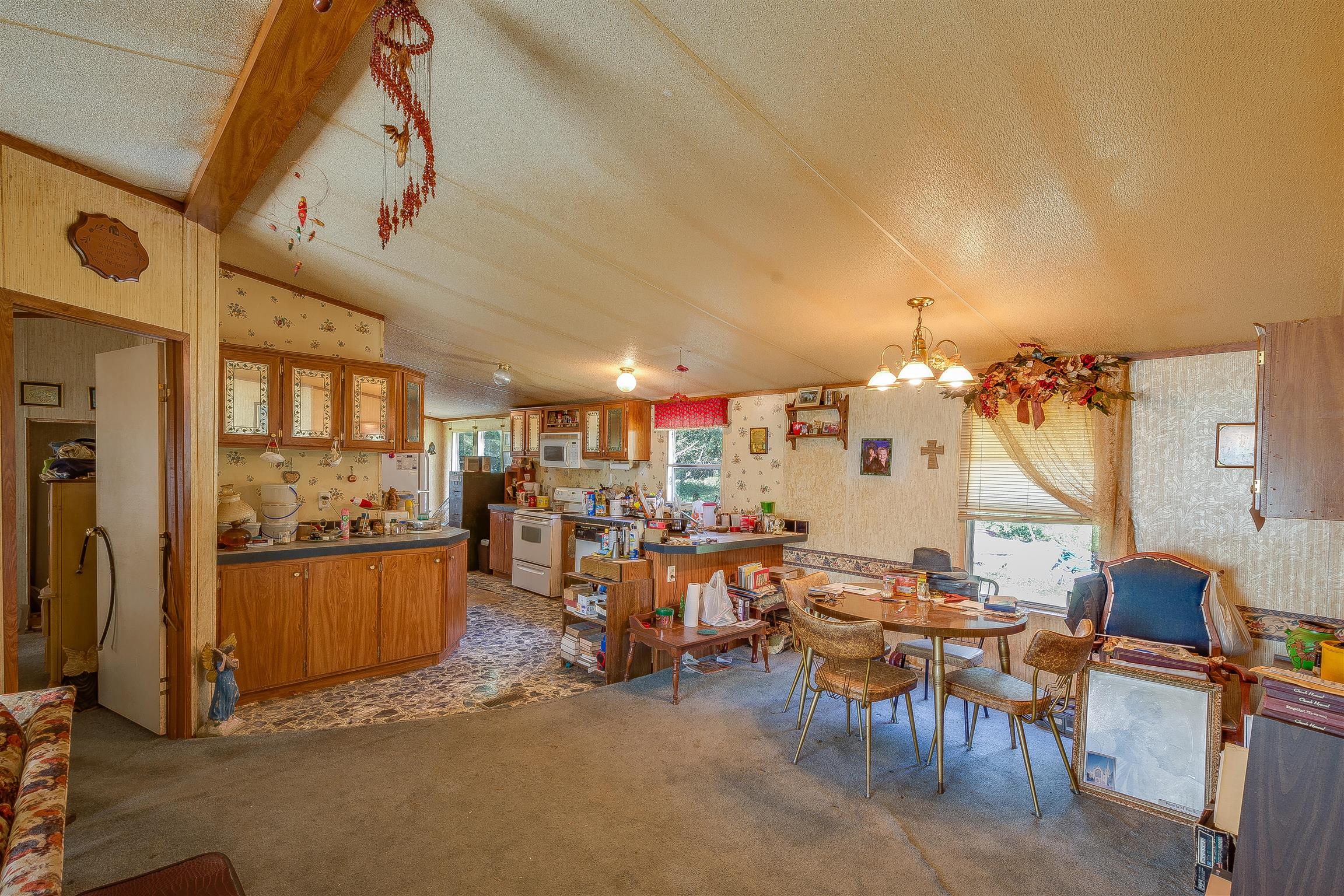 667 Petty Hollow Road Prospect, TN 38477 - Photo 21 of 28 a living room with lots of furniture and a chandelier