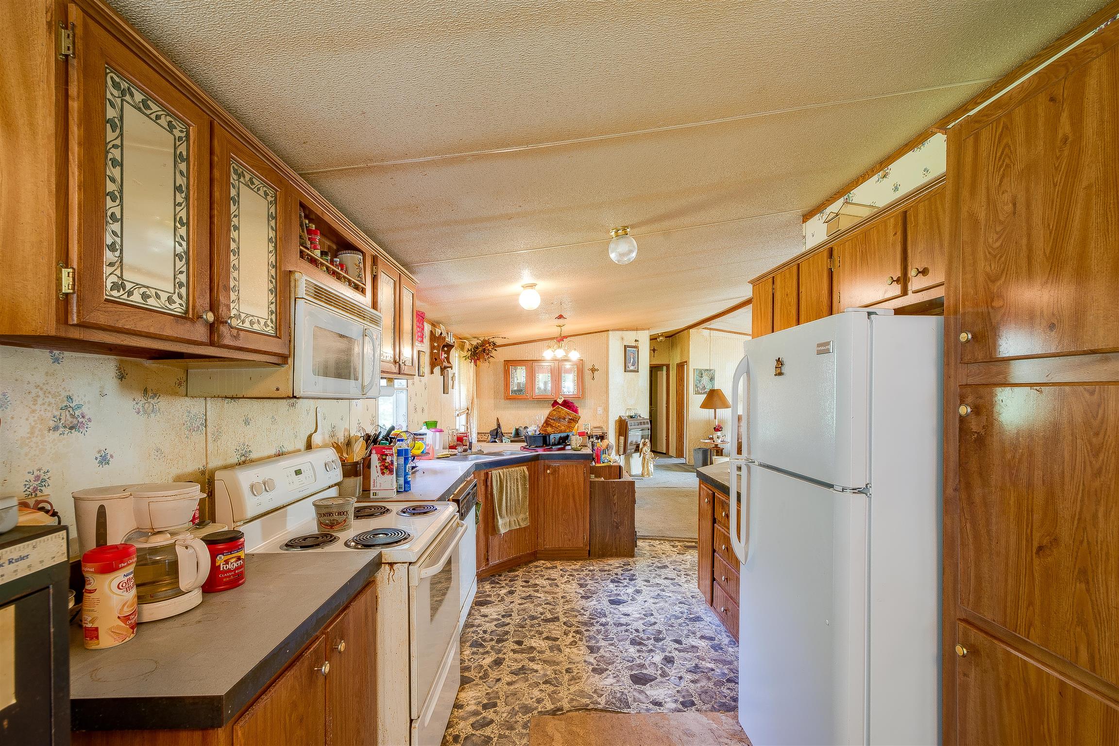 667 Petty Hollow Road Prospect, TN 38477 - Photo 24 of 28 a kitchen with refrigerator and cabinets
