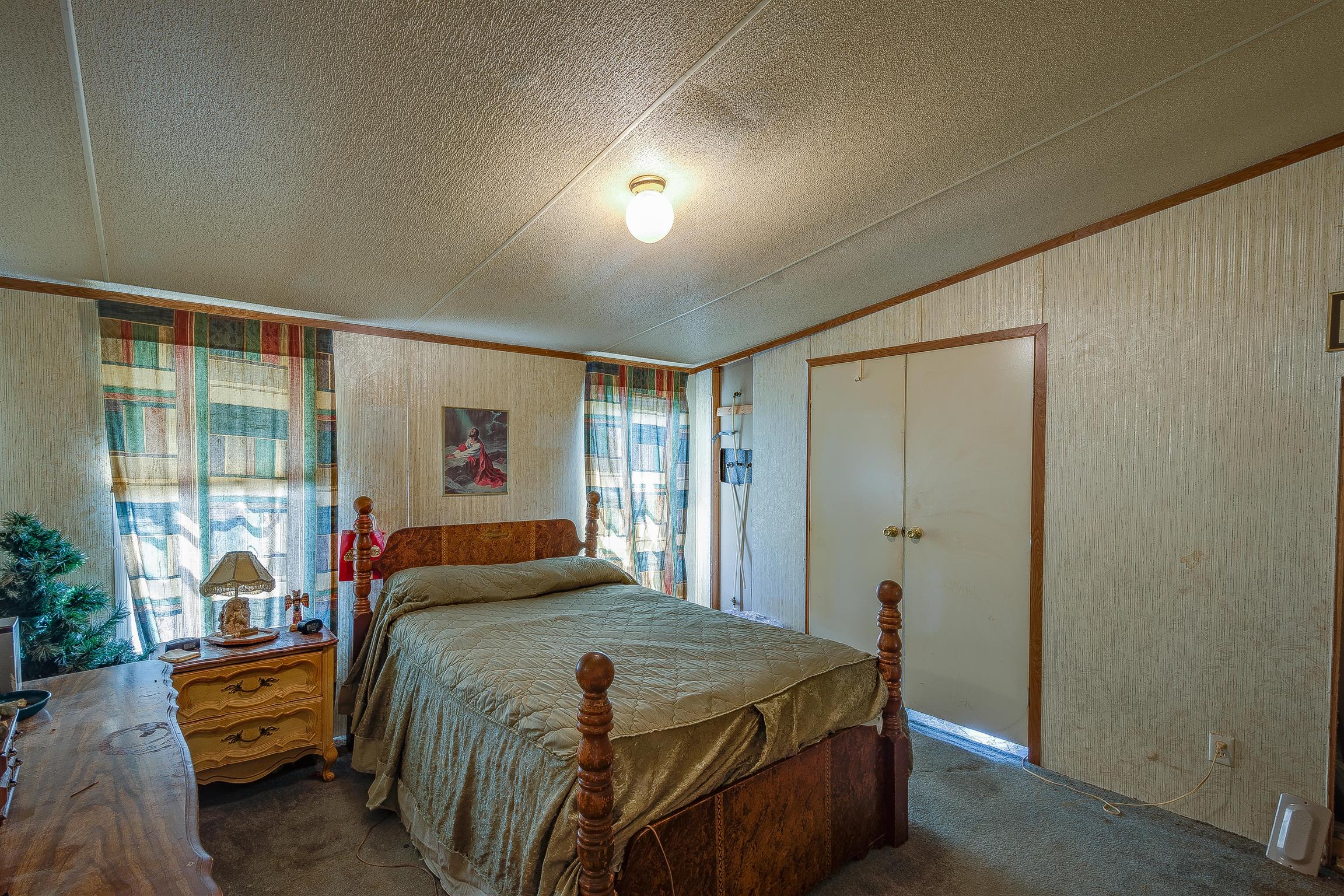 667 Petty Hollow Road Prospect, TN 38477 - Photo 25 of 28 a bedroom with a bed and large windows
