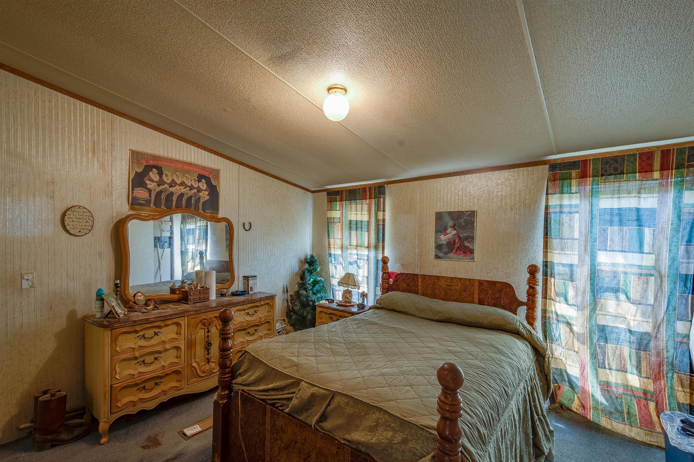 667 Petty Hollow Road Prospect, TN 38477 - Photo 26 of 28 a bedroom with a bed and wooden floor