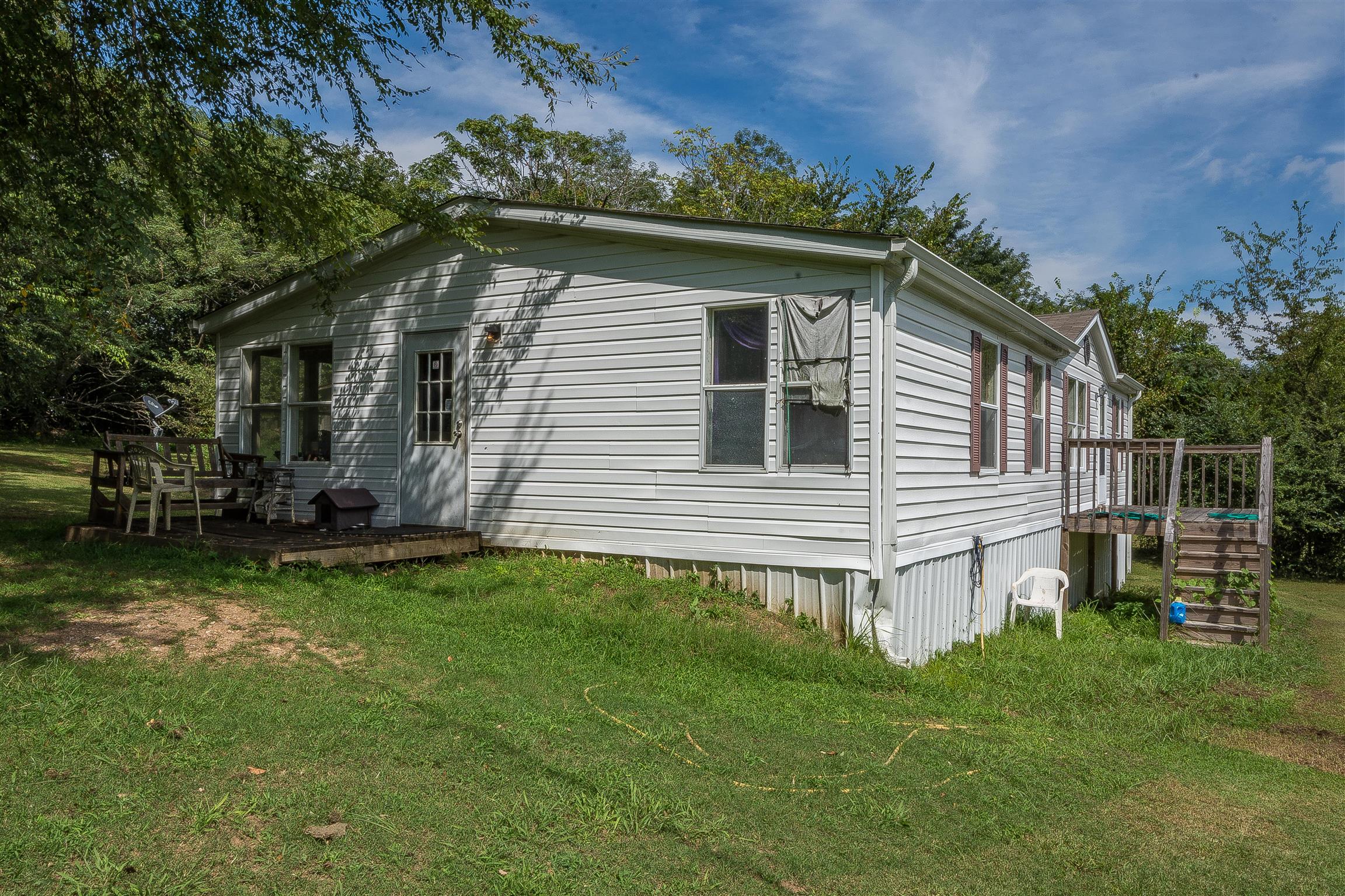 667 Petty Hollow Road Prospect, TN 38477 - Photo 7 of 28 a backyard of a house with lots of green space