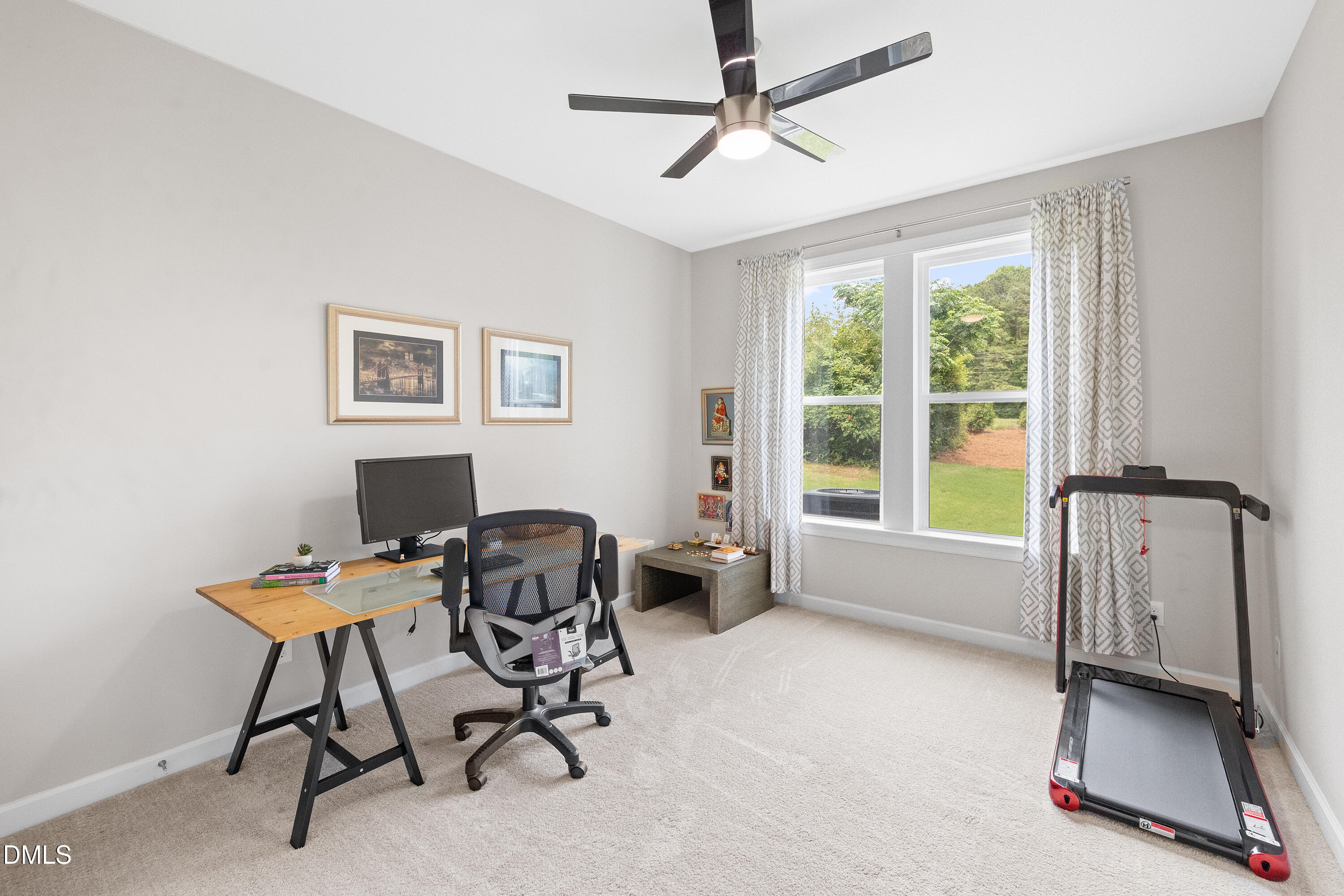 8059 Gilano Drive Raleigh, NC 27603 - Photo 25 of 43 a view of a workspace with furniture and a window