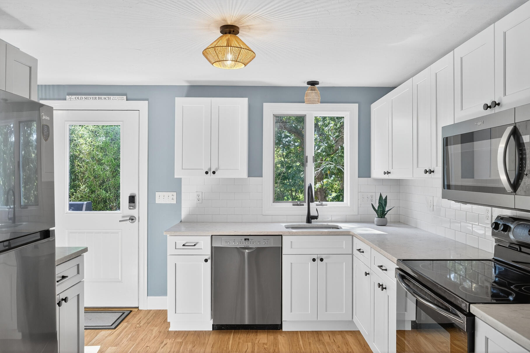 24 Jae Road Falmouth, MA 02556 - Photo 5 of 27 a kitchen with a sink stove and cabinets