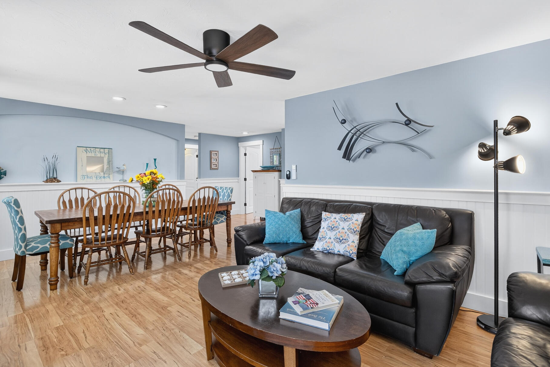 24 Jae Road Falmouth, MA 02556 - Photo 8 of 27 a living room with furniture kitchen view and a wooden floor