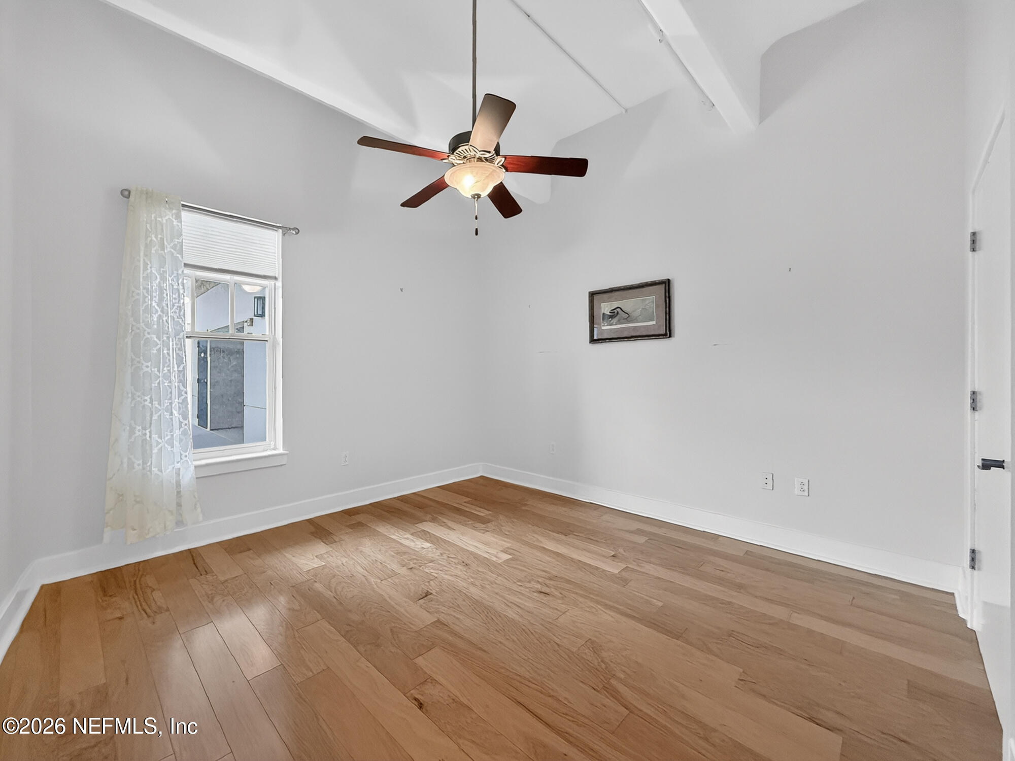 1661 Riverside Avenue, Unit 407 Jacksonville, FL 32204 - Photo 19 of 60 an empty room with a window and a ceiling fan