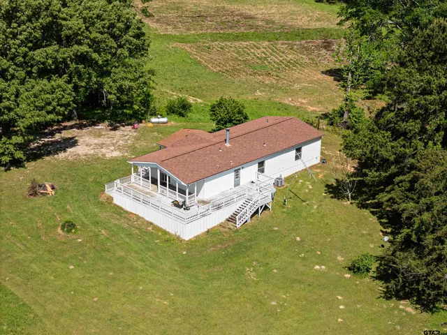 a aerial view of a house with a ocean view