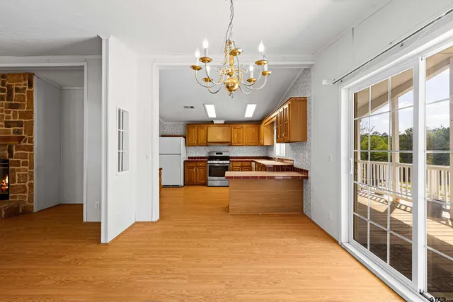 a kitchen with stainless steel appliances granite countertop a stove and refrigerator