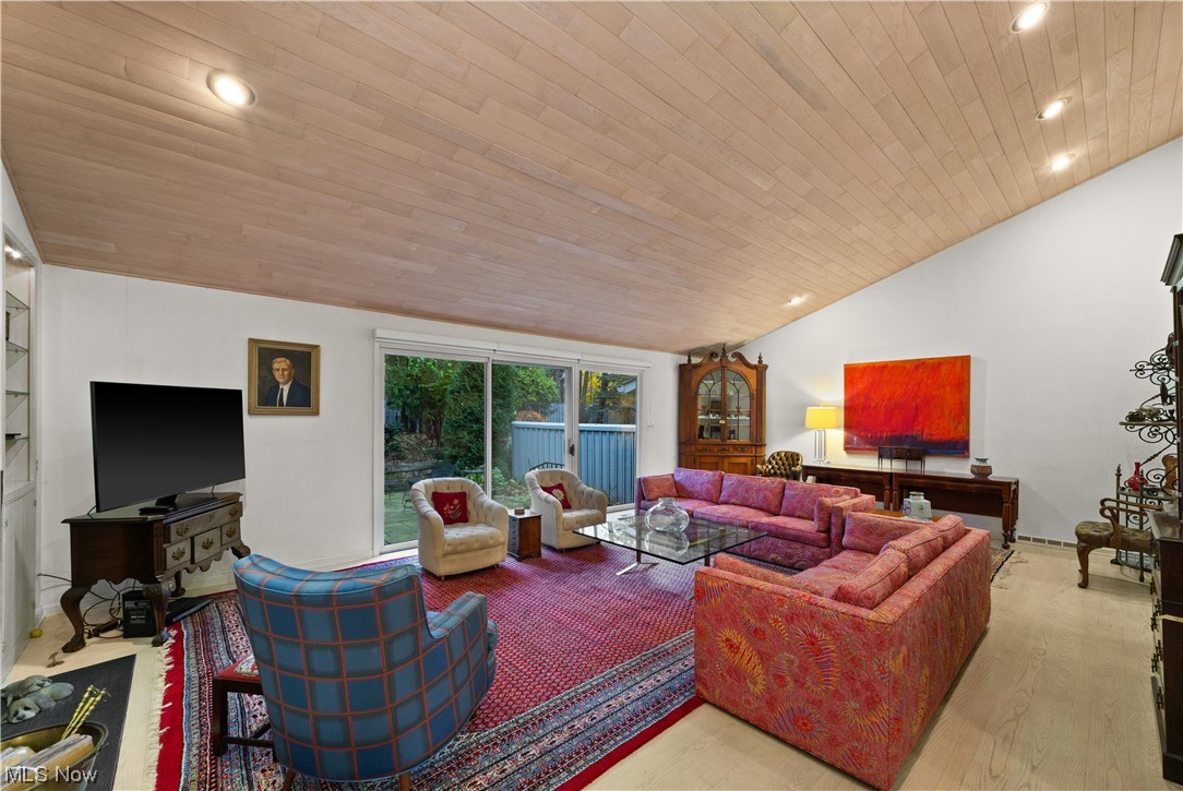 3845 Lander Road, Unit 2 Chagrin Falls, OH 44022 - Photo 8 of 31 Living room with wood ceiling, vaulted ceiling, and light hardwood / wood-style flooring