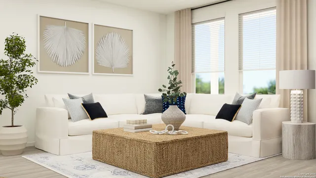 a living room with furniture and large windows