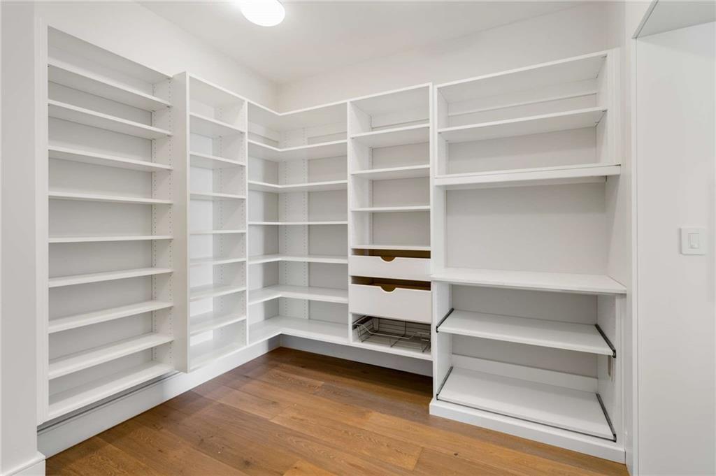 3376 Peachtree Road Northeast, Unit 33B Atlanta, GA 30326 - Photo 15 of 45 a view of walk in closet with empty racks