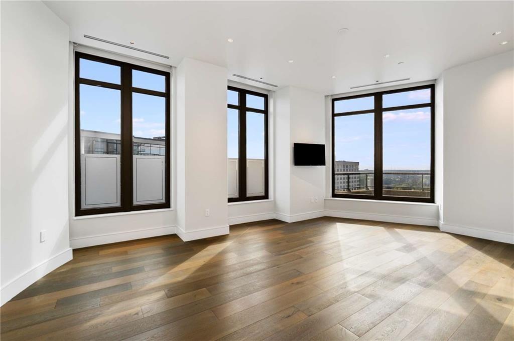3376 Peachtree Road Northeast, Unit 33B Atlanta, GA 30326 - Photo 17 of 45 a view of an empty room with glass door and balcony