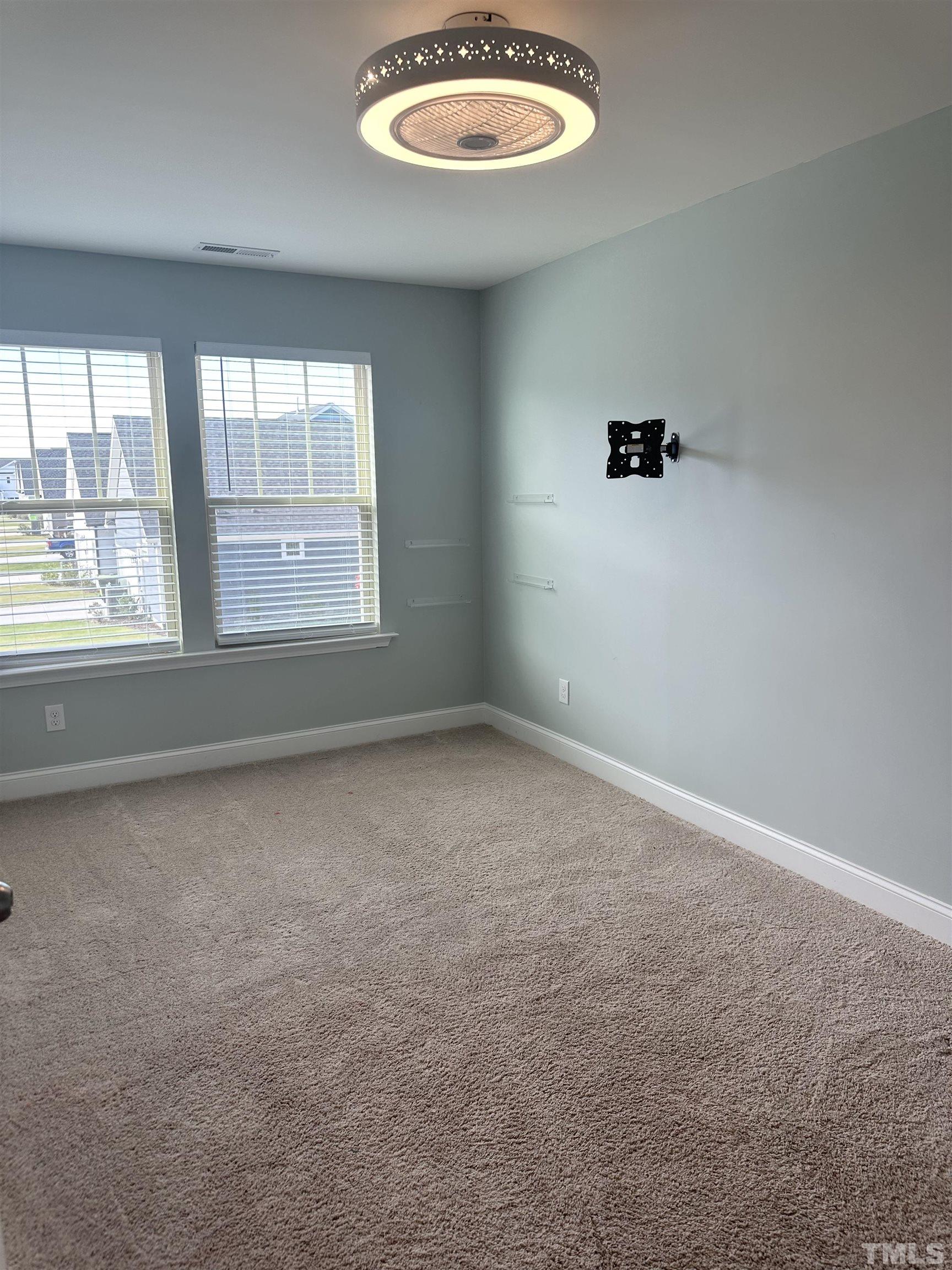 6239 Taylor Road Wendell, NC 27591 - Photo 3 of 3 an empty room with a window