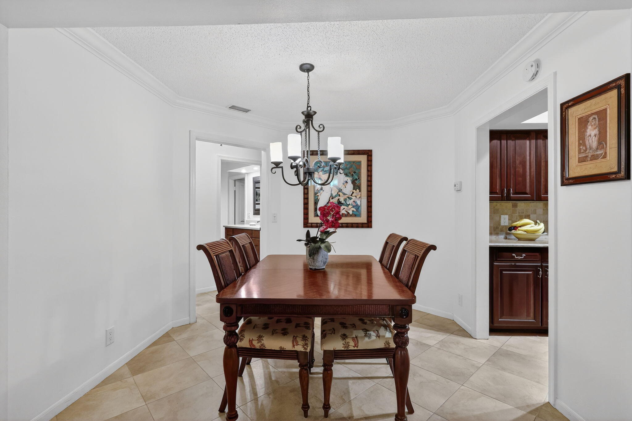 318 Southeast 7th Avenue, Unit 3 Delray Beach, FL 33483 - Photo 14 of 26 a view of a dining room with furniture and chandelier