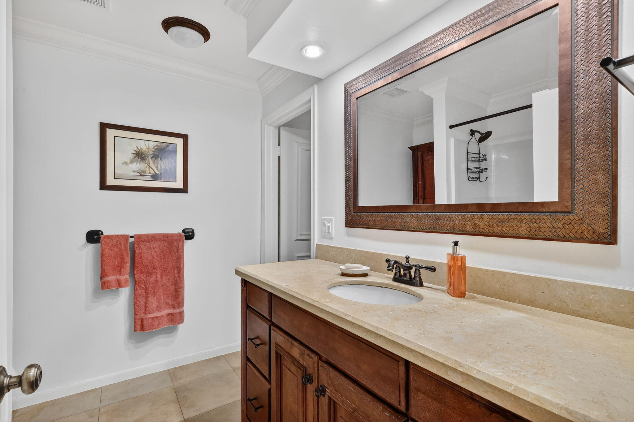 318 Southeast 7th Avenue, Unit 3 Delray Beach, FL 33483 - Photo 19 of 26 a bathroom with a sink vanity and mirror