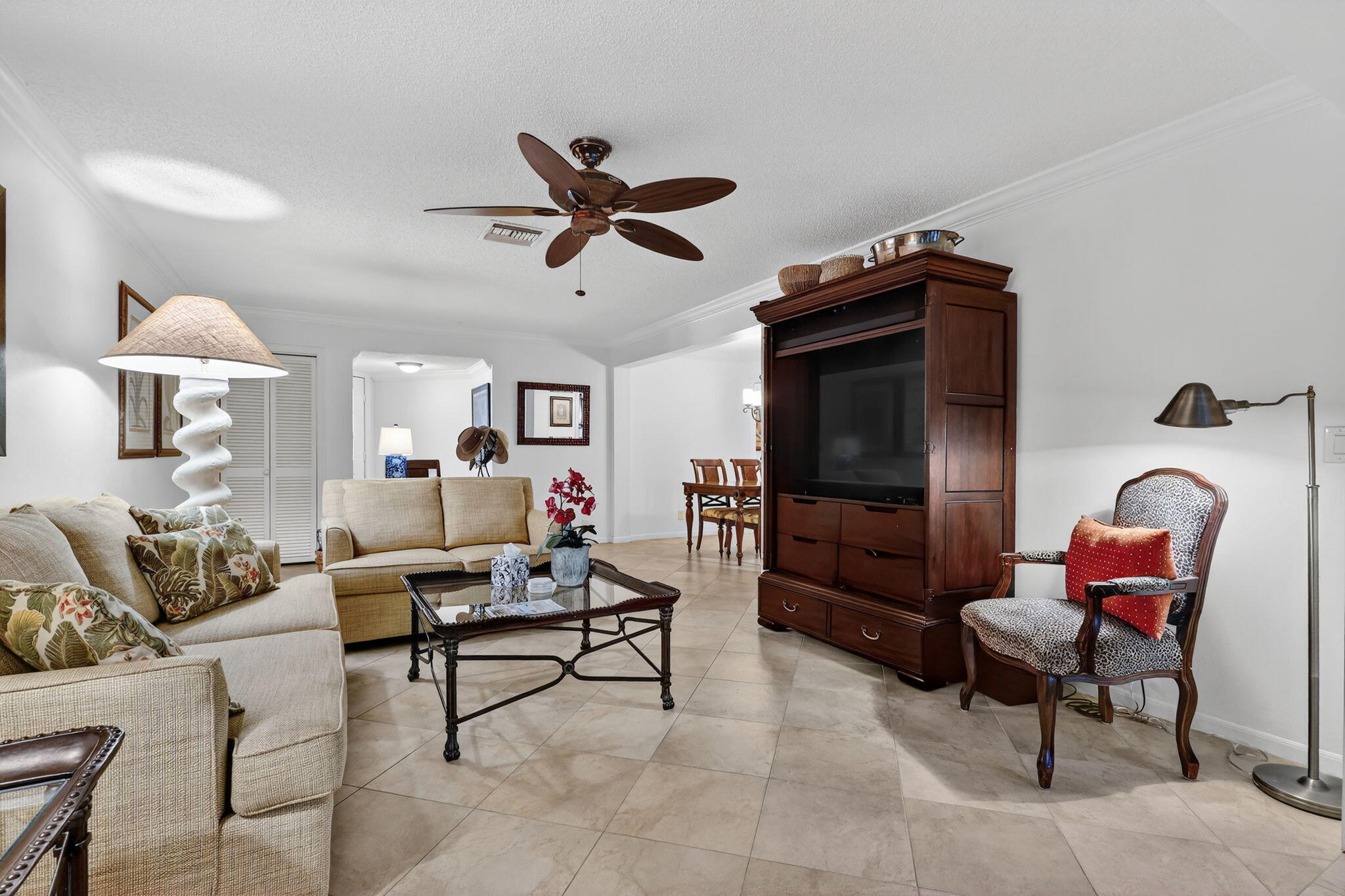 318 Southeast 7th Avenue, Unit 3 Delray Beach, FL 33483 - Photo 7 of 26 a living room with furniture and a flat screen tv