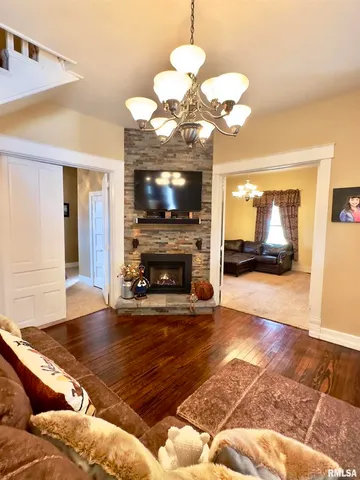 a kitchen with stainless steel appliances granite countertop a sink and a refrigerator