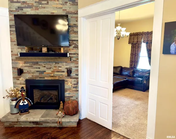 a kitchen with stainless steel appliances wooden cabinets a sink and a large window