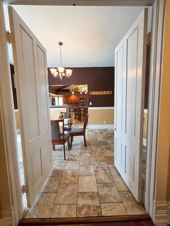 a bedroom with a bed and a mirror