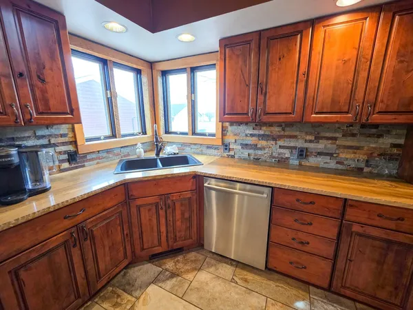 a bedroom with a bed and flat screen tv