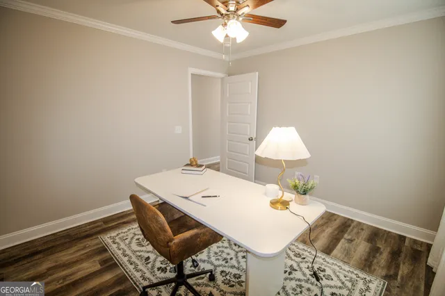 a workspace with furniture and chandelier