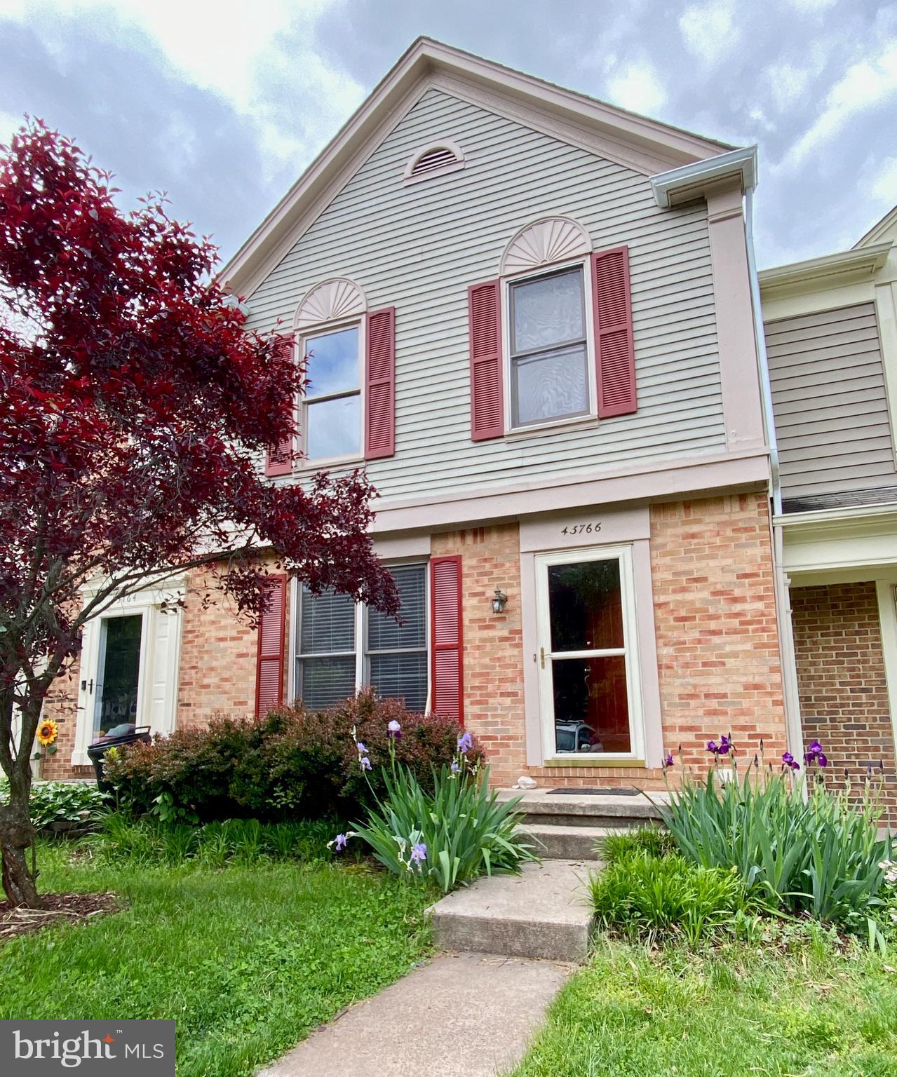 43766 Laburnum Square Ashburn, VA 20147 - Photo 1 of 1 a front view of a house with garden