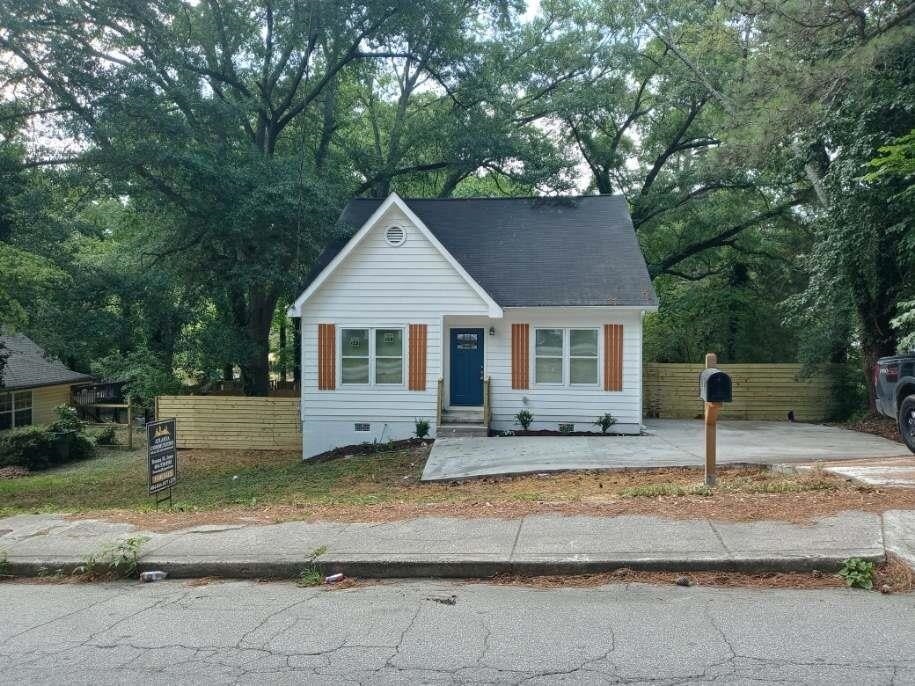 315 Fairburn Road Southwest Atlanta, GA 30331 - Photo 1 of 1 a view of a house with a yard and sitting area
