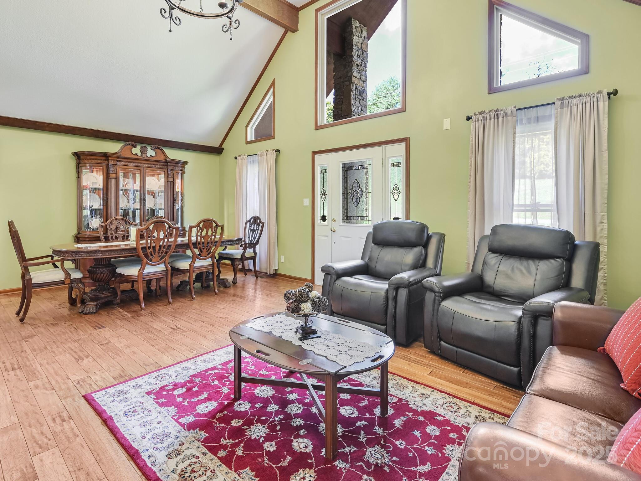 20 Brooks Cove Road Candler, NC 28715 - Photo 13 of 43 a living room with furniture a rug and a table
