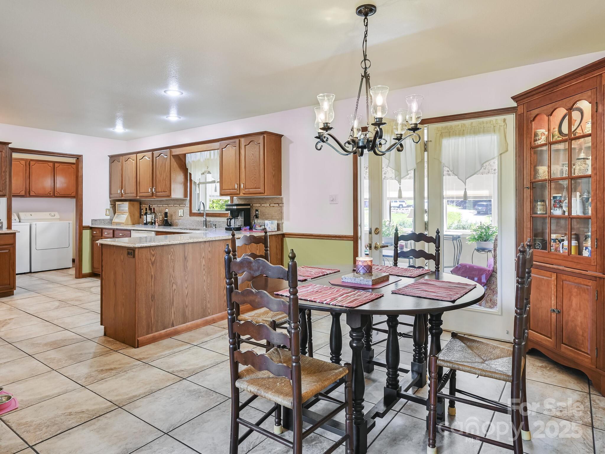 20 Brooks Cove Road Candler, NC 28715 - Photo 15 of 43 a dining room filled chandelier and wooden floor