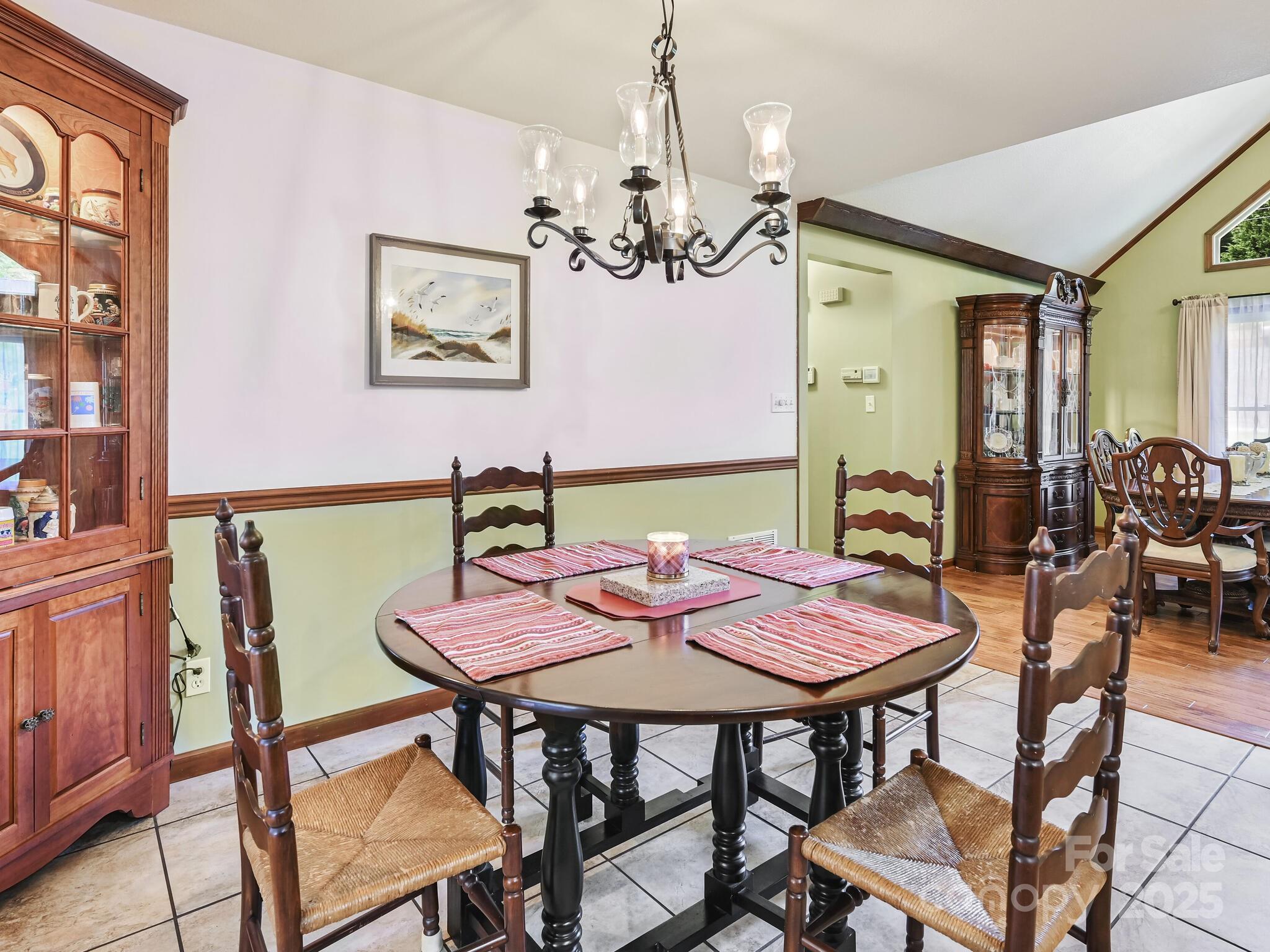 20 Brooks Cove Road Candler, NC 28715 - Photo 18 of 43 a view of a dining room with furniture and chandelier
