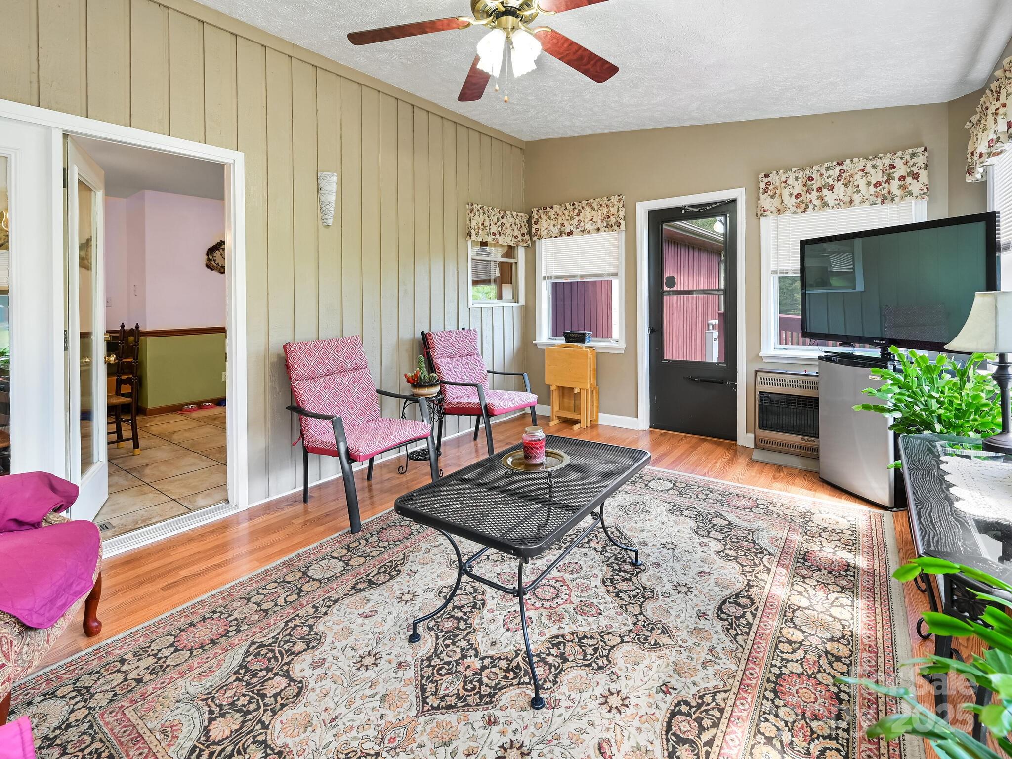 20 Brooks Cove Road Candler, NC 28715 - Photo 25 of 43 a living room with furniture and a flat screen tv