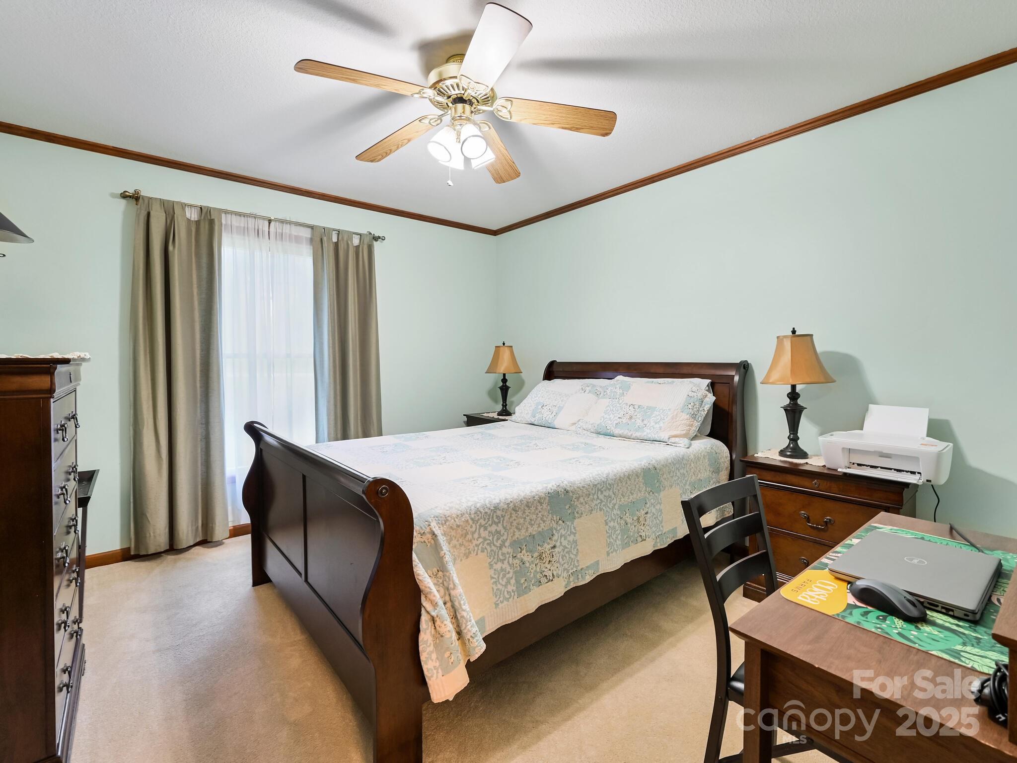 20 Brooks Cove Road Candler, NC 28715 - Photo 27 of 43 a bedroom with a bed and a chandelier